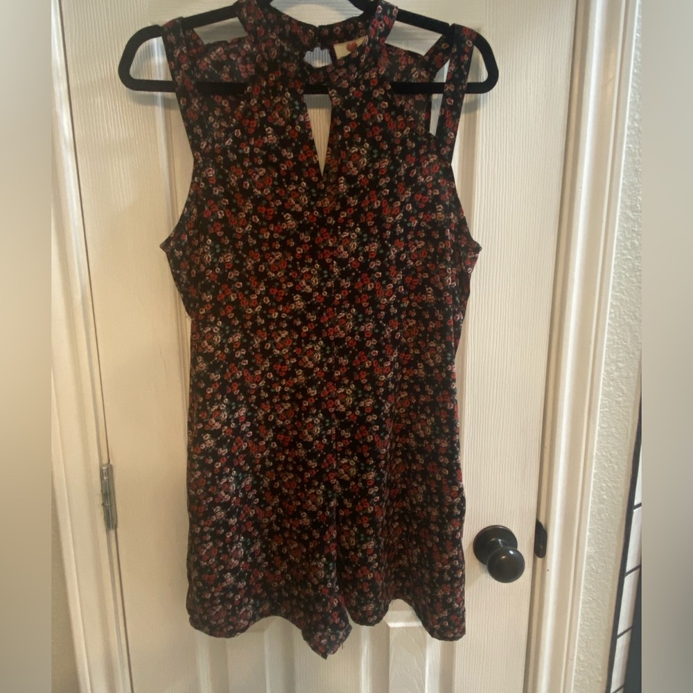 Macys- Junior romper- black with shades of red and pink flowers.